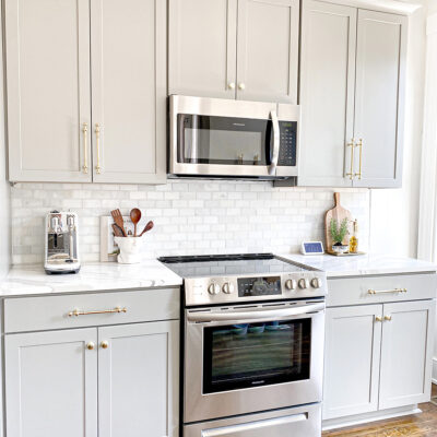 a white kitchen with a clean stove