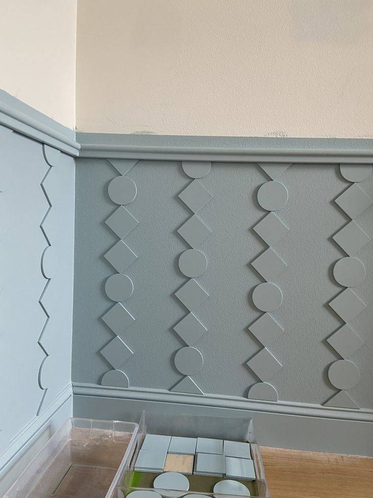 Green geometric wainscoting on lower panel of walls