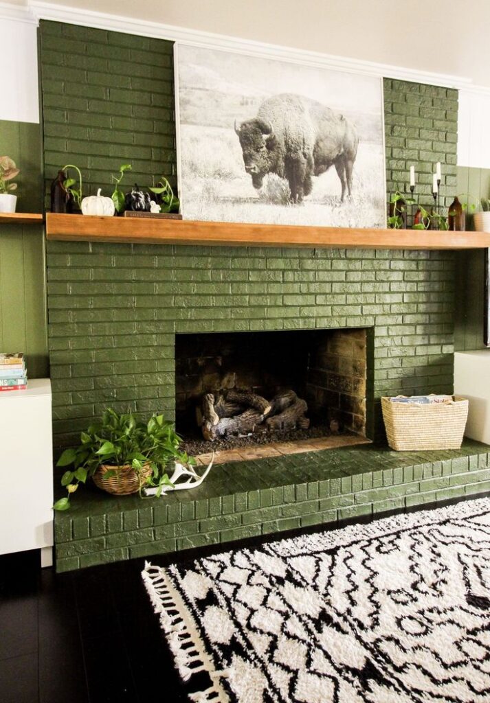 Green brick fireplace with buffalo photo above