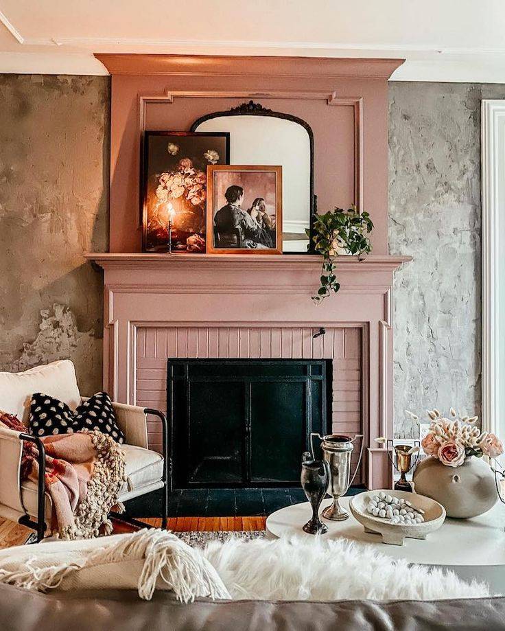 Mauve fireplace with grey background, mirror and art on mantle