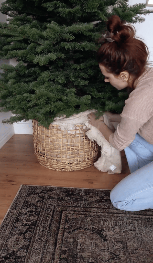 Open weave basket paired with a cozy blanket from Lily Ardor. 