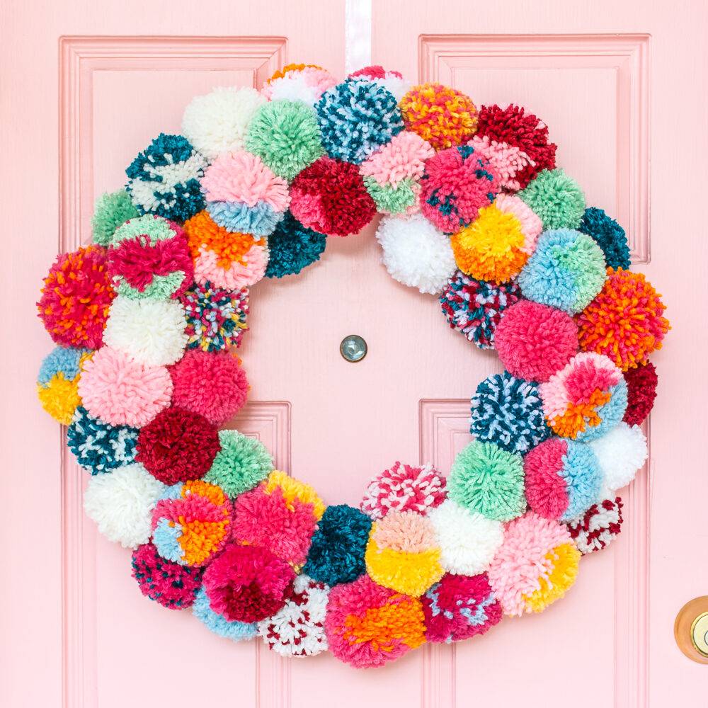 Bright and colorful DIY boho holiday pom-pom wreath