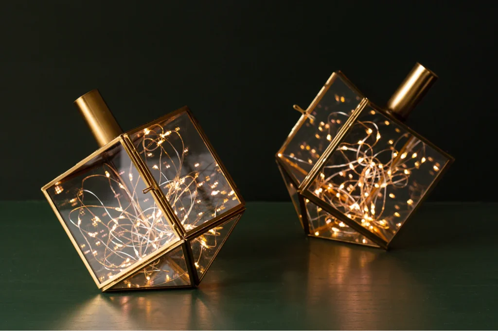 Add air plants or fairy lights to these beautiful dreidels from Adara Rituals. 