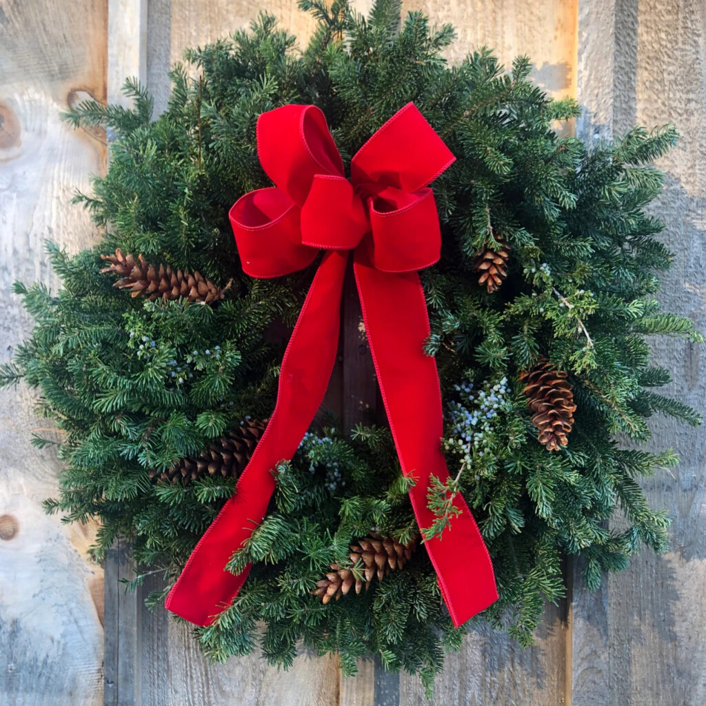 Green handmade wreath  with red bow