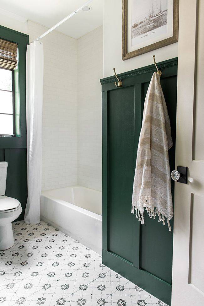 Green wainscoting and tile floor