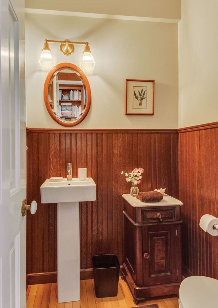 Victorian bathroom with wood paneling wainscoting