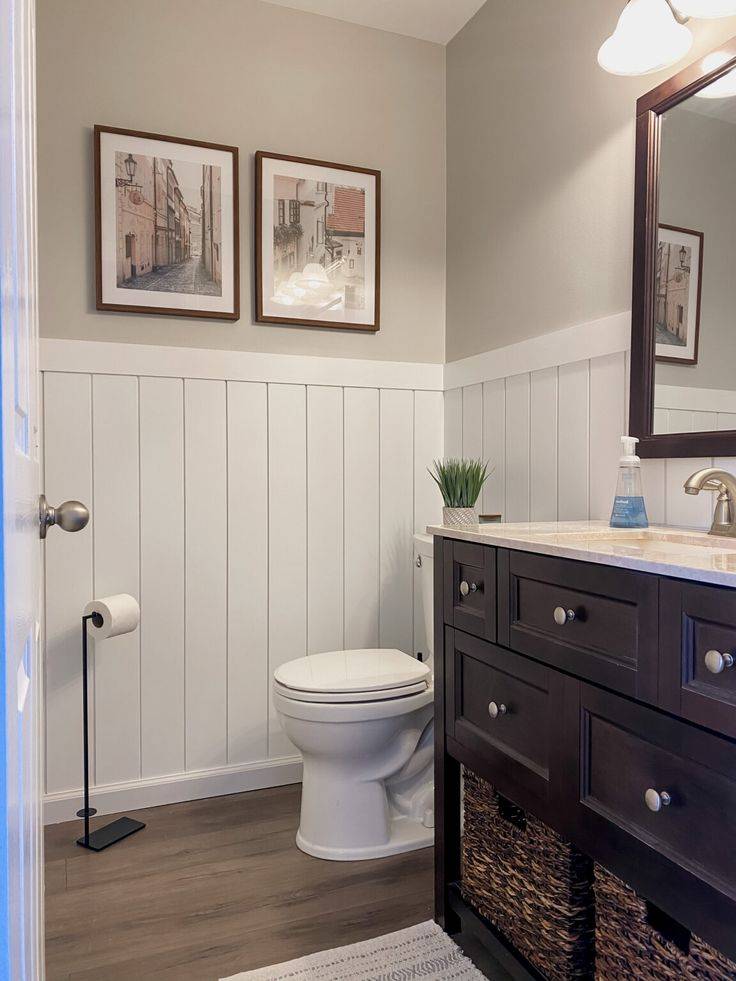 Shiplap wainscoting in cream and brown bathroom