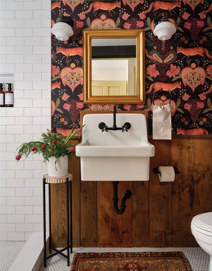 Wood wainscoting in bathroom with rustic wallpaper