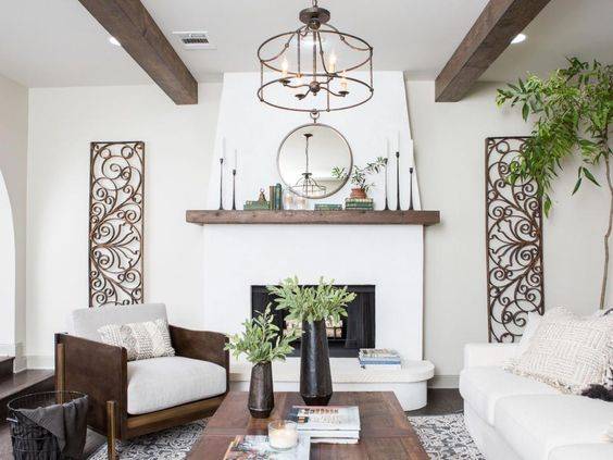 White stucco fireplace in living room with brown accents