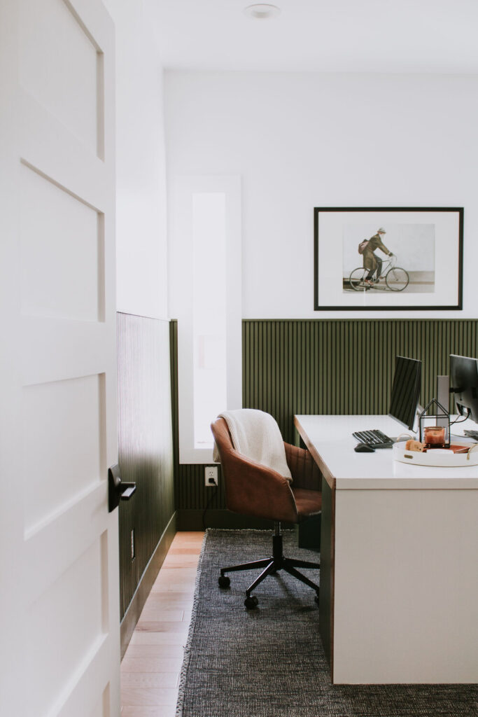 dark green wainscoting in a home office. 