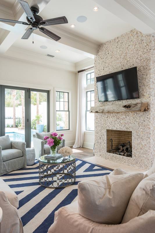Living with stucco fireplace with seashells 