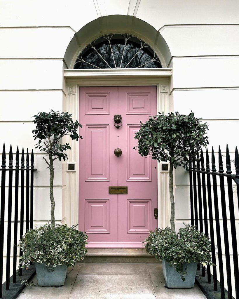 Pink entrance door in old building