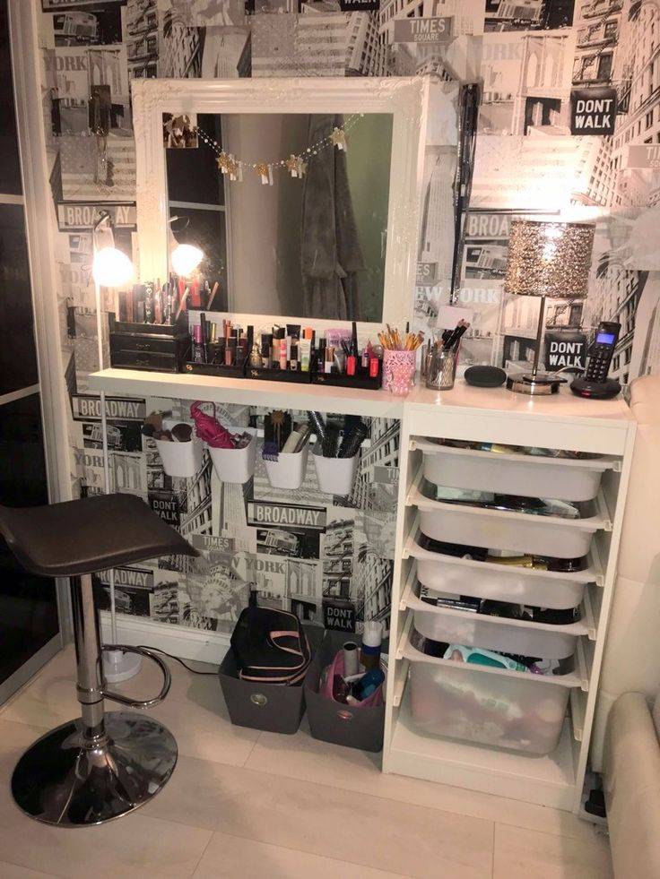 Makeup vanity with a white Ikea Trofast attached. Large mirror on top.