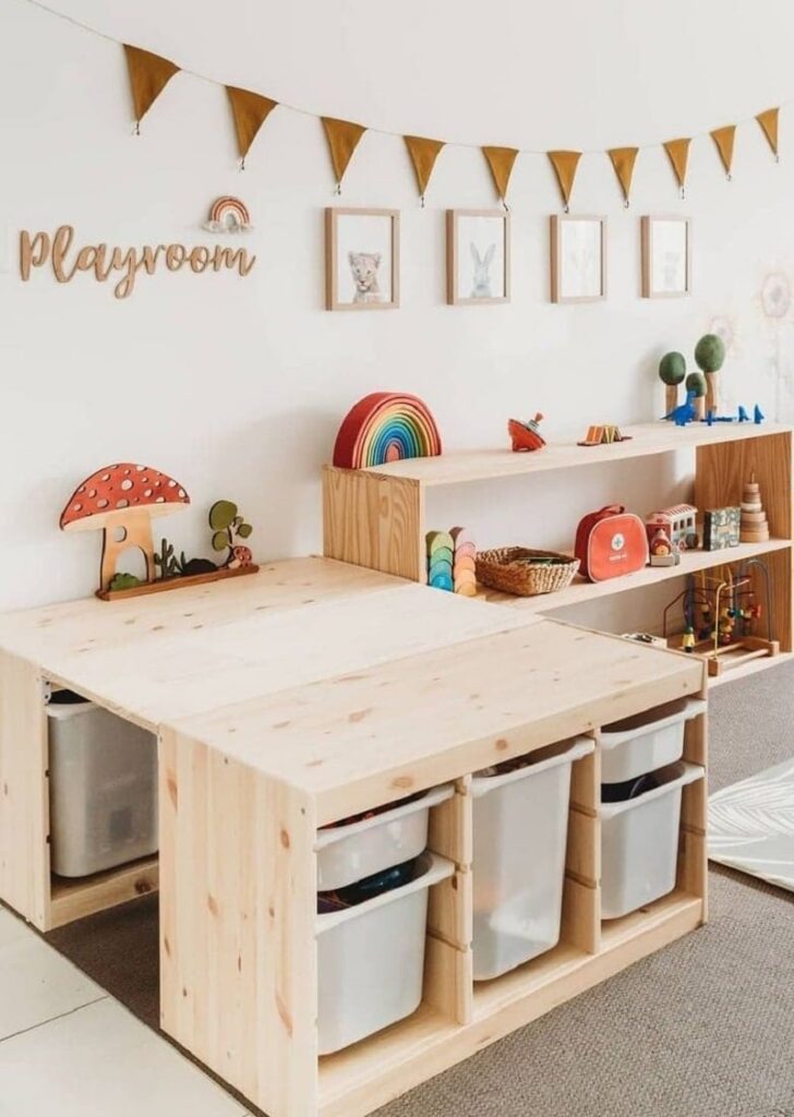 Ikea trofast with wood table and white bins in child's playroom