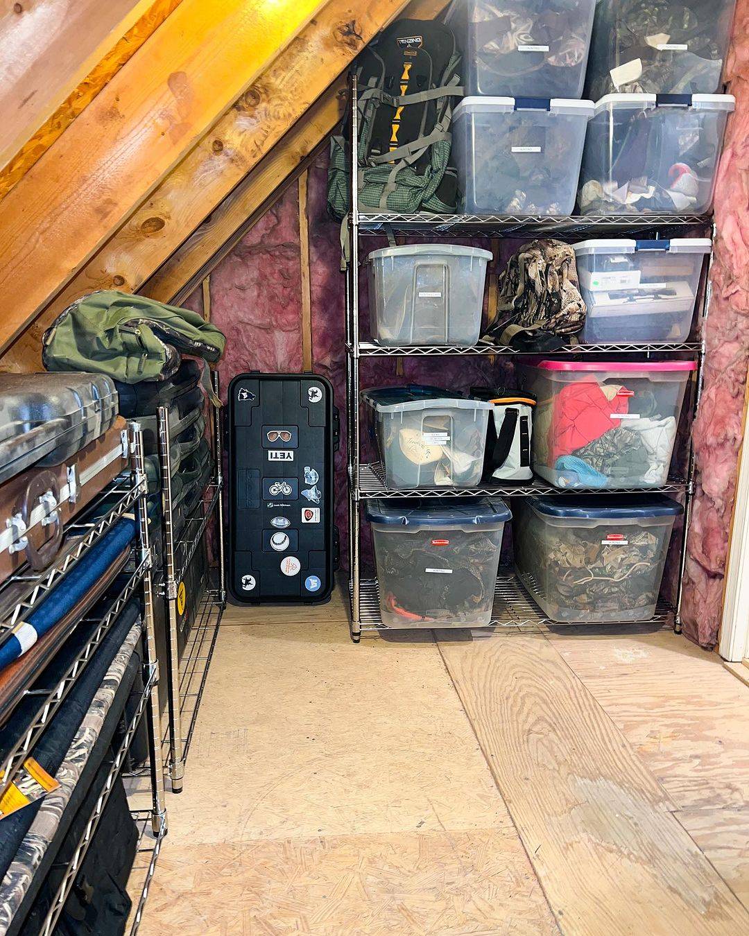 Clear storage bins stacked in attic 