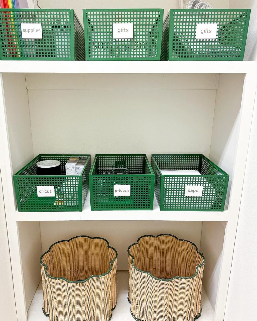 Green bins with white labels and rattan bins on white shelf