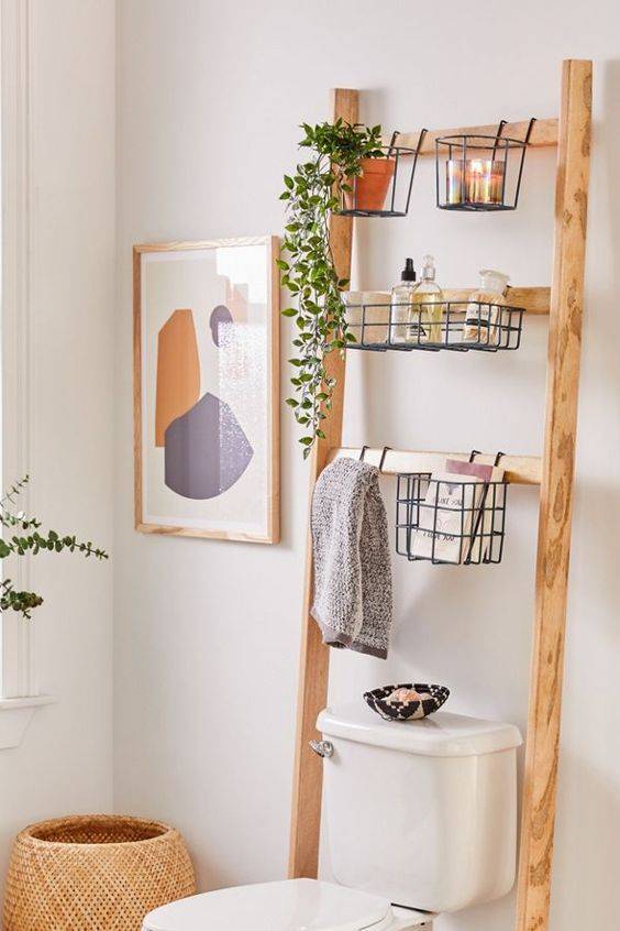 Repurposed wooden shelf over toilet for bathroom storage