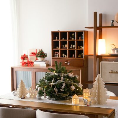 A dining room table with a christmas tree on it