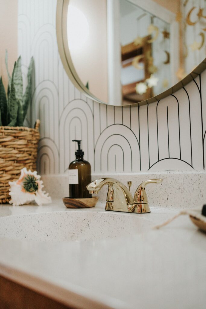 a bathroom sink with a mirror above it